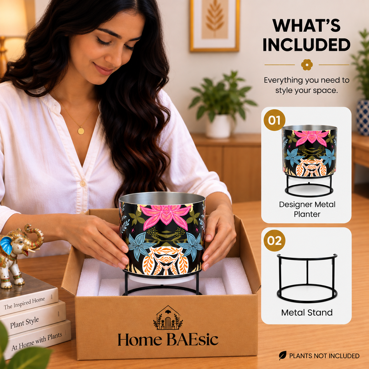 Home BAEsic Floral Fantasy designer metal tumbler planter with black metal stand shown inside an open box during unboxing, with a woman gently touching the planter and “What’s Included” callouts.