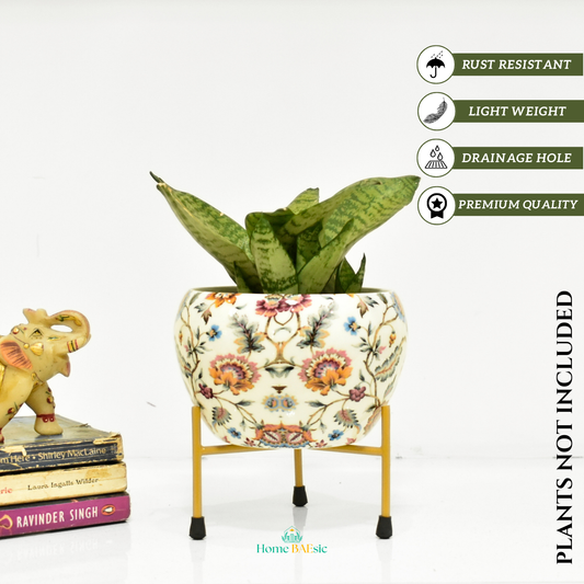 A multicolored floral metal planter with a stand. Blossom Paradise Planter with stand | 6 Inches | Home BAEsic | Home and Garden