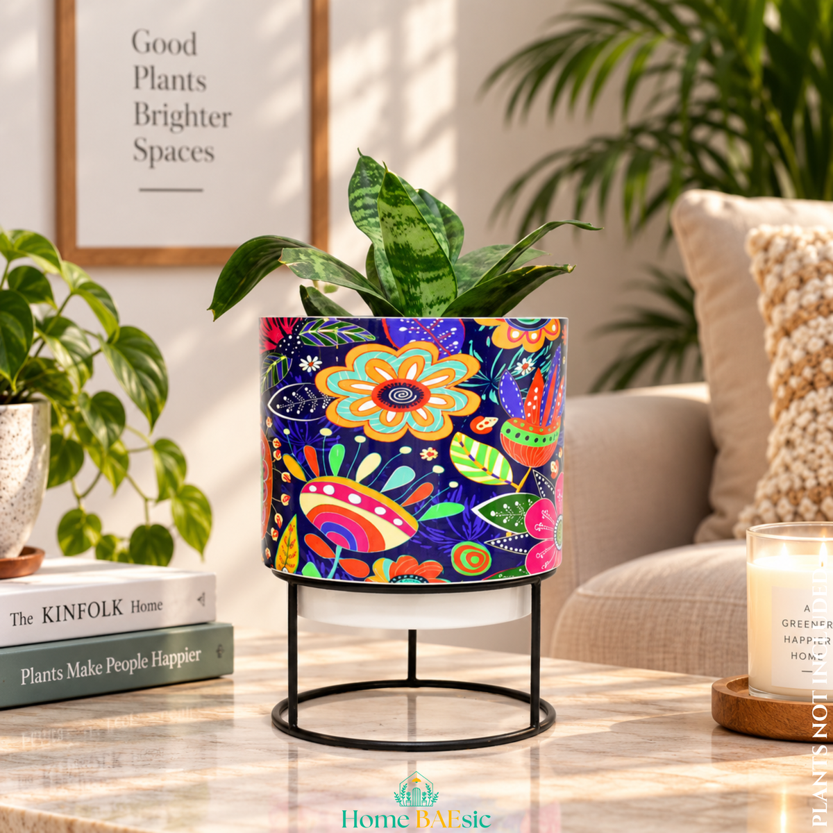 Floral Doodle tumbler metal planter with stand styled with a green indoor plant