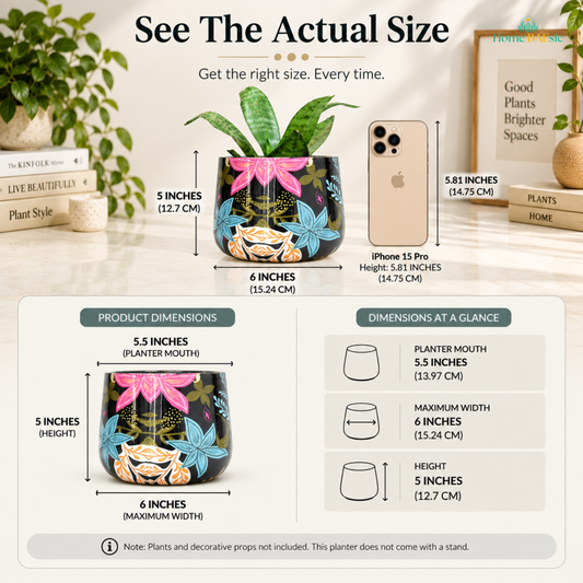 See the actual size of the Home BAEsic Flower Fantasy Tumbler planter, shown beside an iPhone 15 Pro for scale, with dimensions of 5.5-inch planter mouth, 6-inch maximum width, and 5-inch height. Plants and decorative props are not included; planter does not come with a stand.