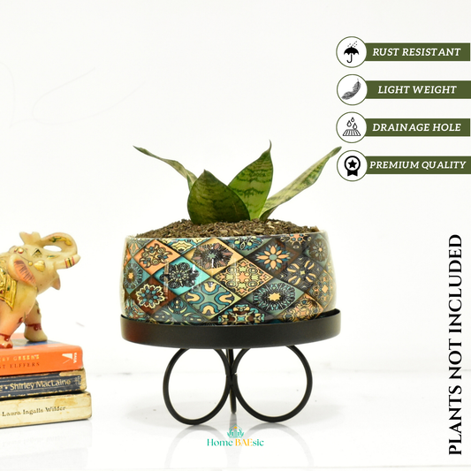 Decorative planter with a colorful patchwork motif design. Floral Motif Indoor Metal Planter With Tripod Tray For Home & Garden | Home BAEsic 