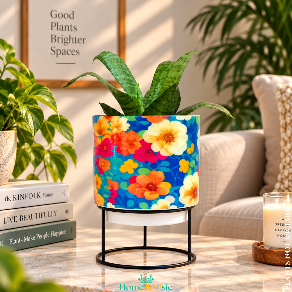 Flower Art designer metal tumbler planter with stand, featuring a colorful floral pattern and green indoor plant, styled as a modern home decor accent.