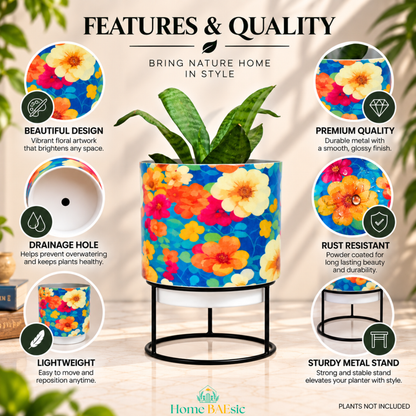 Flower Art Metal tumbler planter with stand featuring vibrant floral artwork, drainage hole, rust-resistant powder-coated finish, lightweight metal construction, premium quality, and sturdy black metal stand.