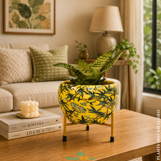 Leafy Yellow metal planter with stand by Home BAEsic styled with a snake plant in a warm modern living room