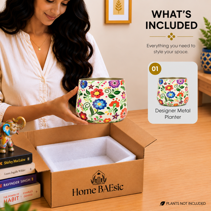 Home BAEsic Multifloral tumbler planter with colorful floral artwork shown in hand and in the What's Included callout.