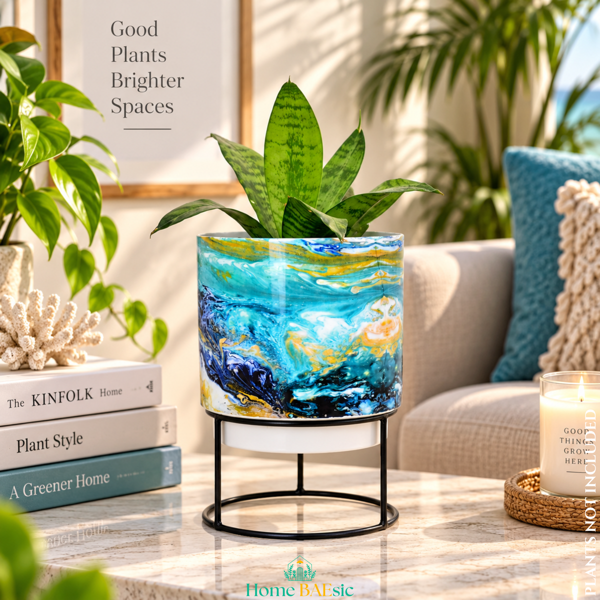 Oceanic Turquoise designer metal tumbler planter with stand, featuring blue, turquoise, white and golden marbled artwork with a green indoor plant.