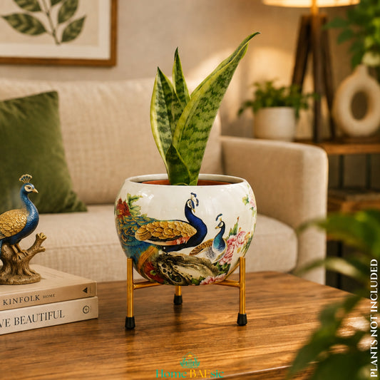 Peacocks in Garden designer metal planter with indoor plant on golden metal stand in a stylish living room