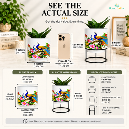 Peacocks in Garden Tumbler Metal Planter with stand showing actual size, compared with an iPhone 15 Pro for scale. The infographic displays 5-inch planter height, 6-inch maximum width, 5.5-inch planter mouth, and 8-inch height with metal stand, with product dimensions and inclusion note.