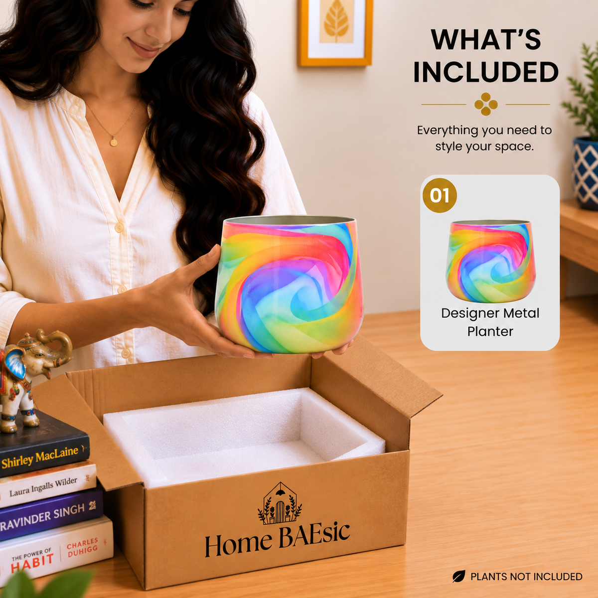 Home BAEsic Peacocks in Rainbow Breeze Tumbler Planter with colorful abstract design, shown in hand alongside the matching designer metal planter in the What's Included display.